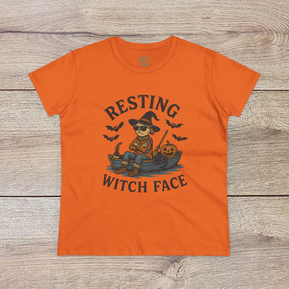 Resting Witch Face Halloween T-Shirt for Women, featuring a vibrant orange shirt with a cartoon witch graphic, perfect for Halloween fun and themed gift giving.