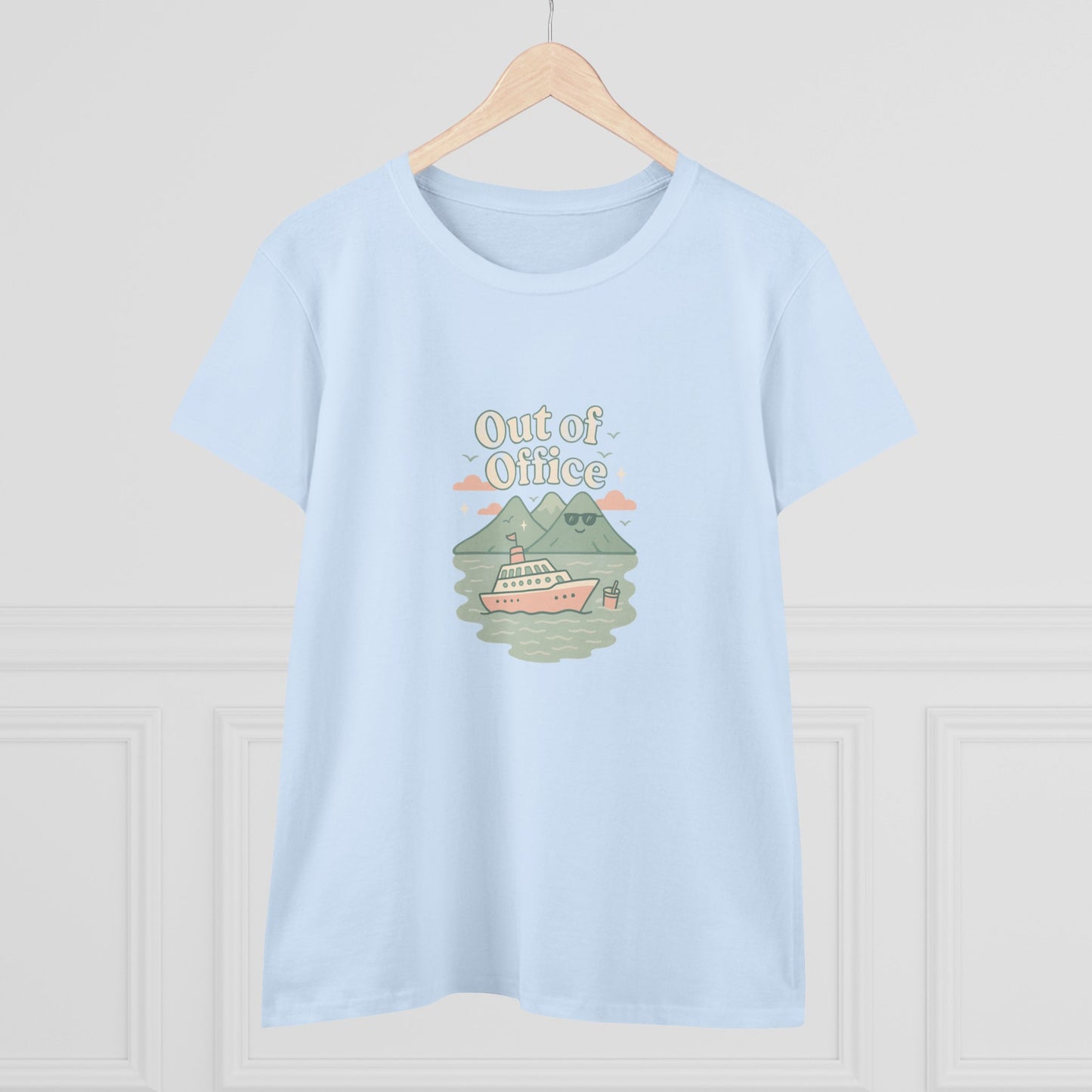 Out Of Office Cruise Tee in light blue showcasing a charming graphic of a cruise ship among mountains and clouds, perfect for layering in warmer climates.