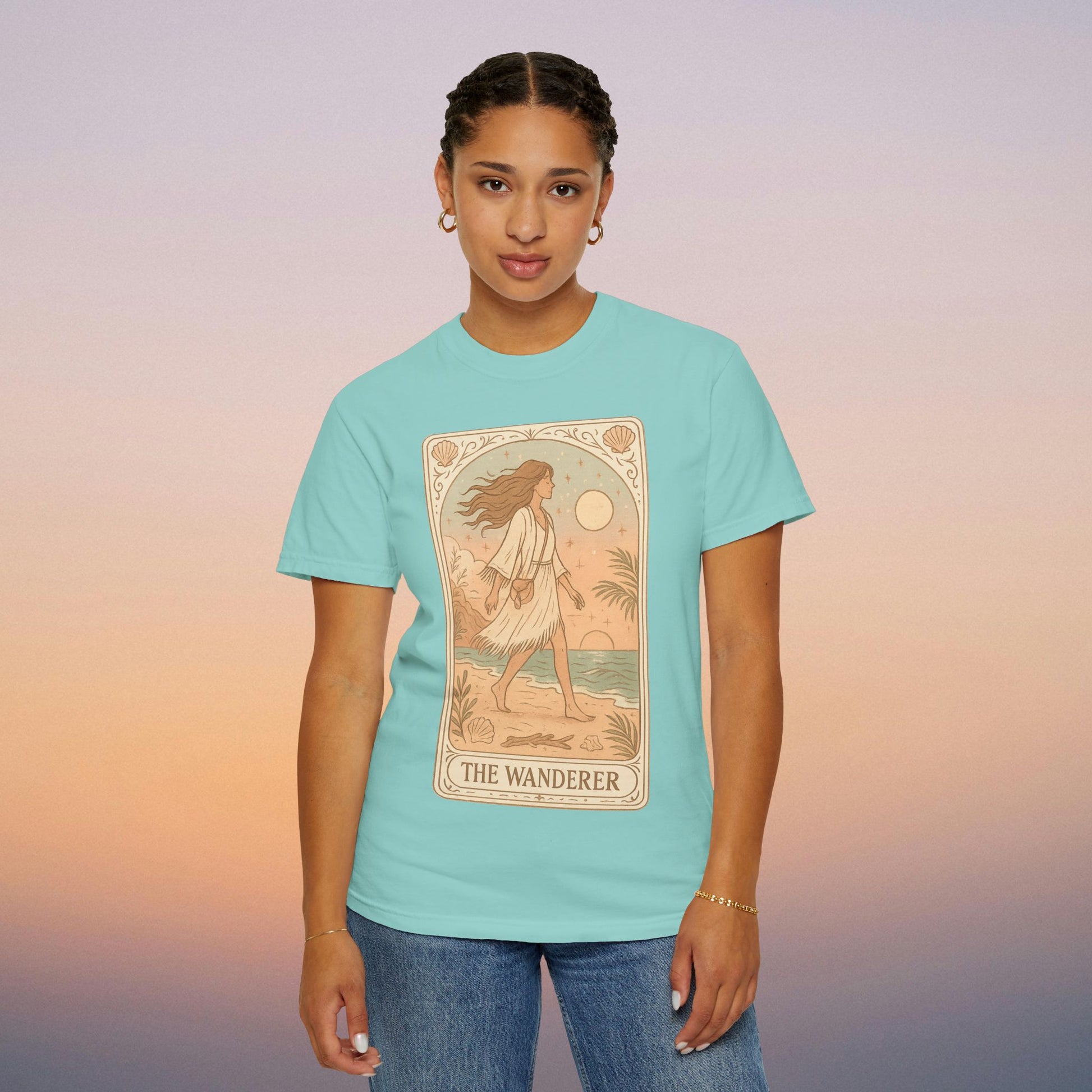 Wanderer Tarot Graphic Tee in cool teal, highlighting the enchanting design of The Wanderer. Ethically crafted from 100% cotton, this comfortable tee is available in sizes S to 4XL, blending style with ethical fashion.
