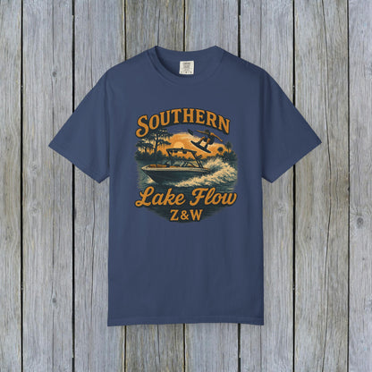 Southern Lake Flow T-Shirt in navy blue, showcasing a retro wakeboarding graphic against a serene lake backdrop, ideal for those who love outdoor adventures and sustainable clothing.
