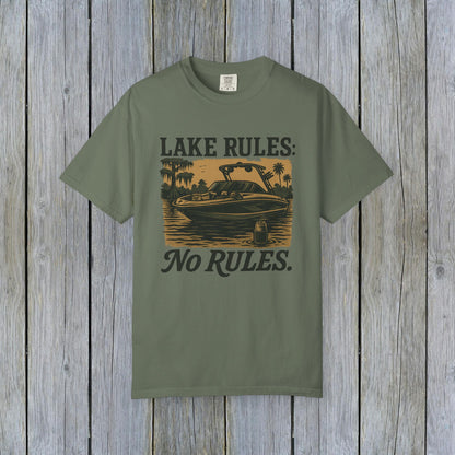 Unisex Garment-Dyed Lake Rules Tee in sage green featuring a boat on a lake with 'Lake Rules: No Rules.' caption, made with soft vintage fabric, perfect for casual outings.