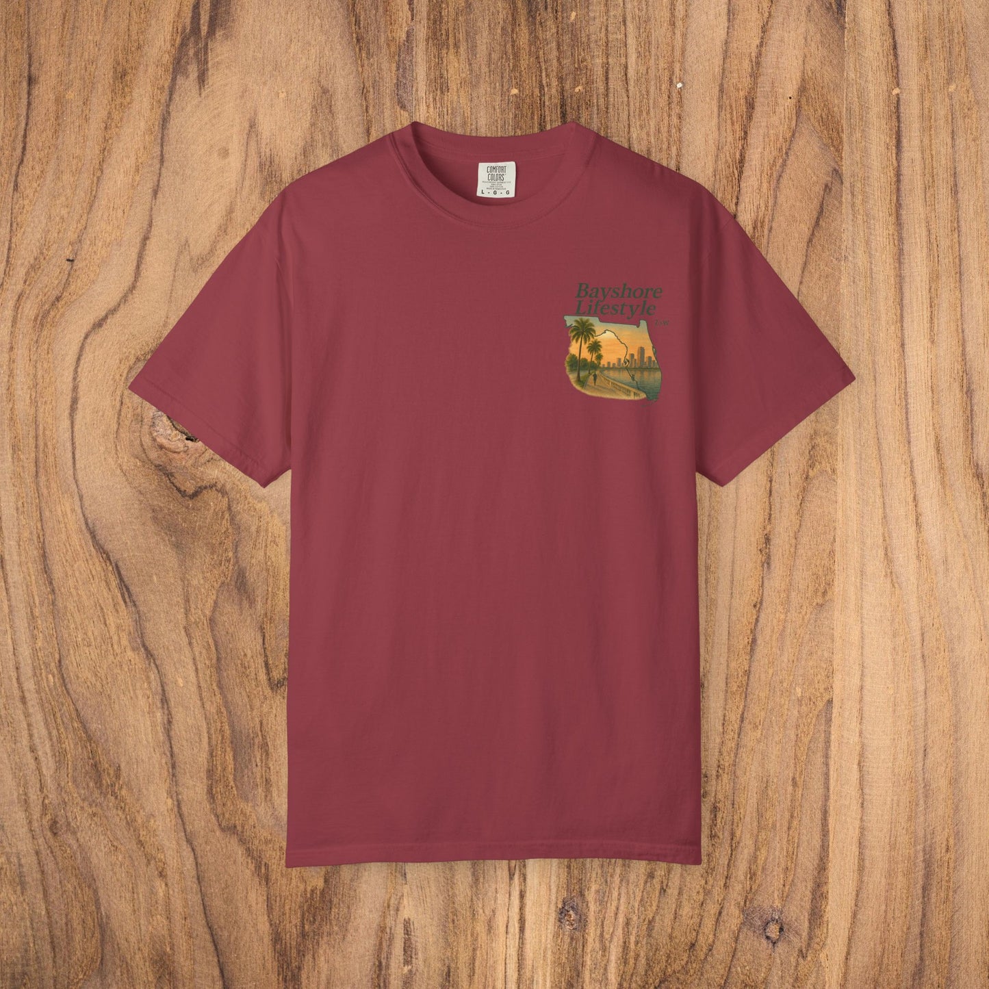 Bayshore Lifestyle Tee in rich maroon color, displaying a charming palm tree motif. Constructed from 100% cotton lightweight fabric, it is offered in sizes XS through 5XL.