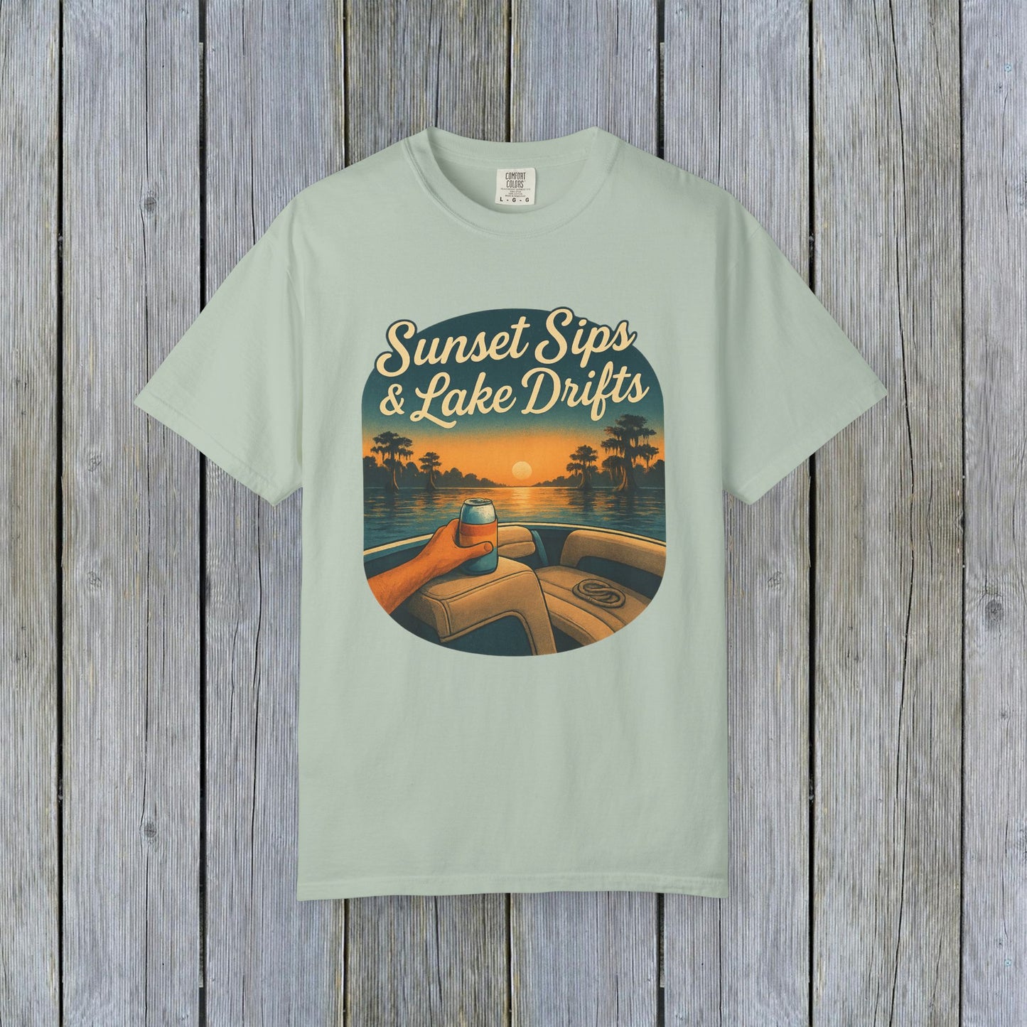 Lake Drifts T-Shirt in soft mint color featuring a sunset and a drink, perfect for casual wear and outdoor adventures.