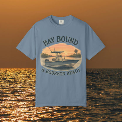 Bay Bound & Bourbon Ready T-Shirt in blue, featuring an artistic boat graphic set against a sunset, perfect for summer fishing trips.