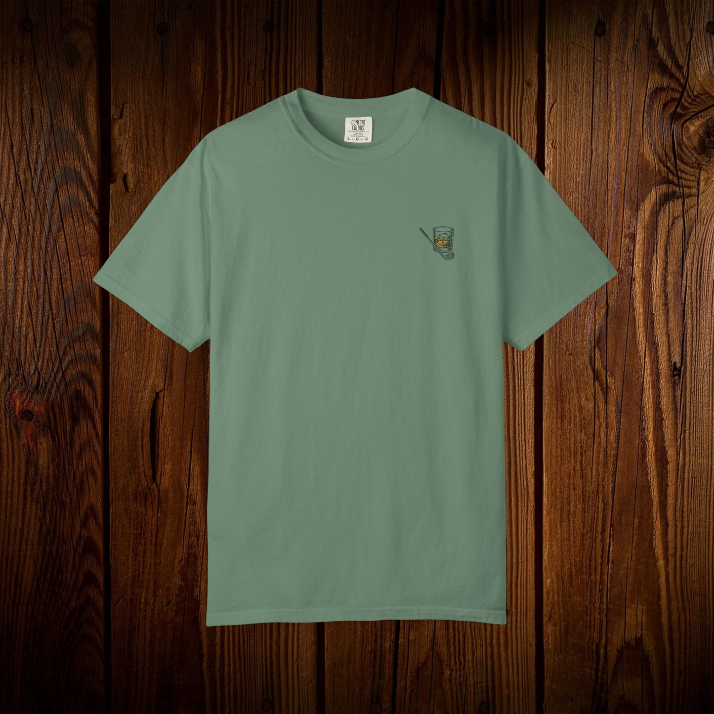 Men's Golf & Whiskey Tee in muted green, crafted from soft cotton with an eco-friendly design and unique natural color, ideal for golf lovers.