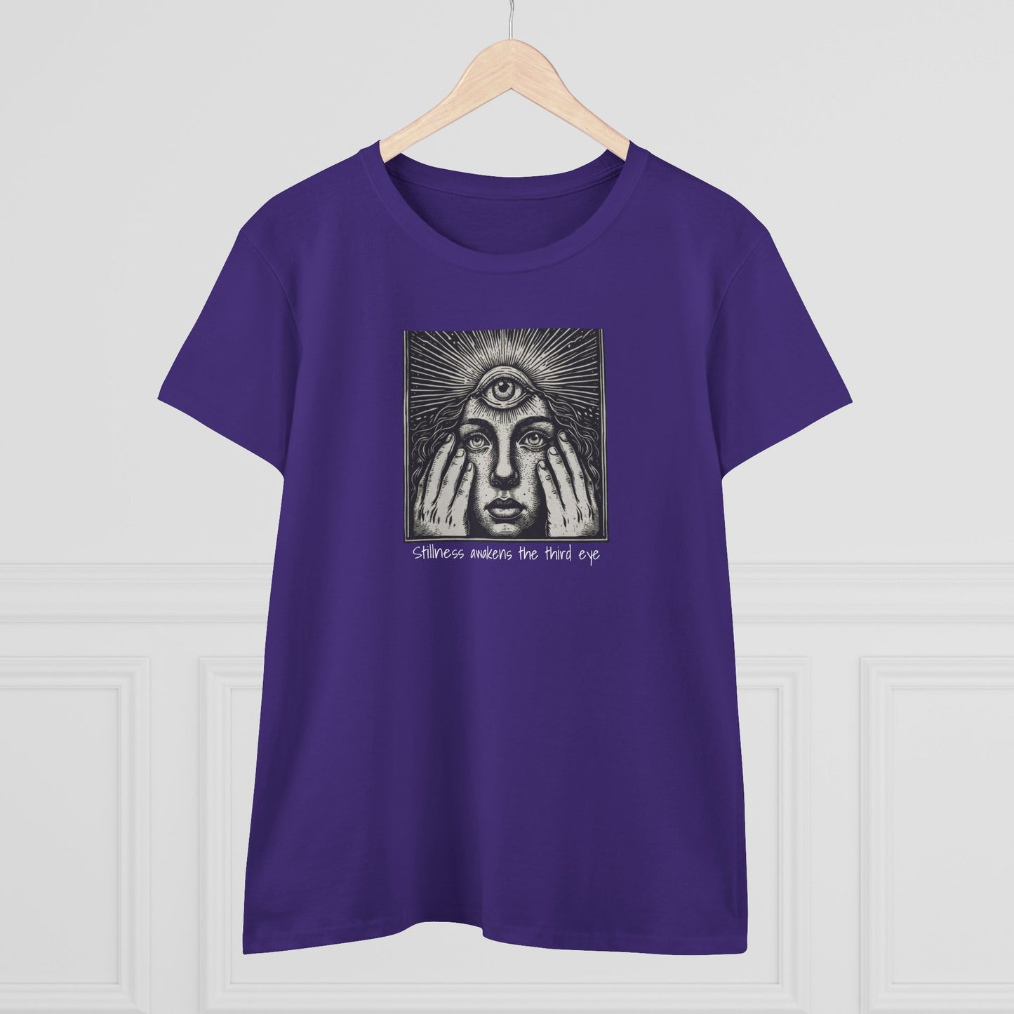Stylish Third Eye Graphic Tee displayed on a wooden hanger in a bold purple color, featuring a prominent third eye graphic that evokes themes of insight and perspective.