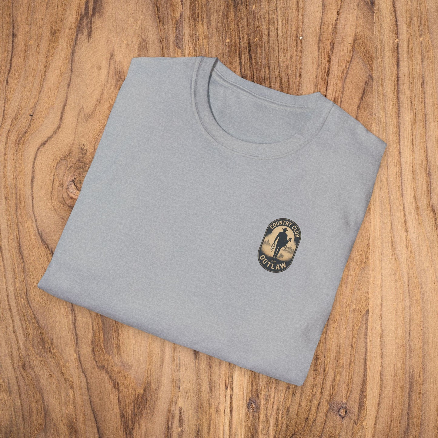 Vintage Southern Gentleman Golf Shirt - Country Club Outlaw Cowboy Tee displayed on a wooden surface, showcasing its classic fit and soft texture.