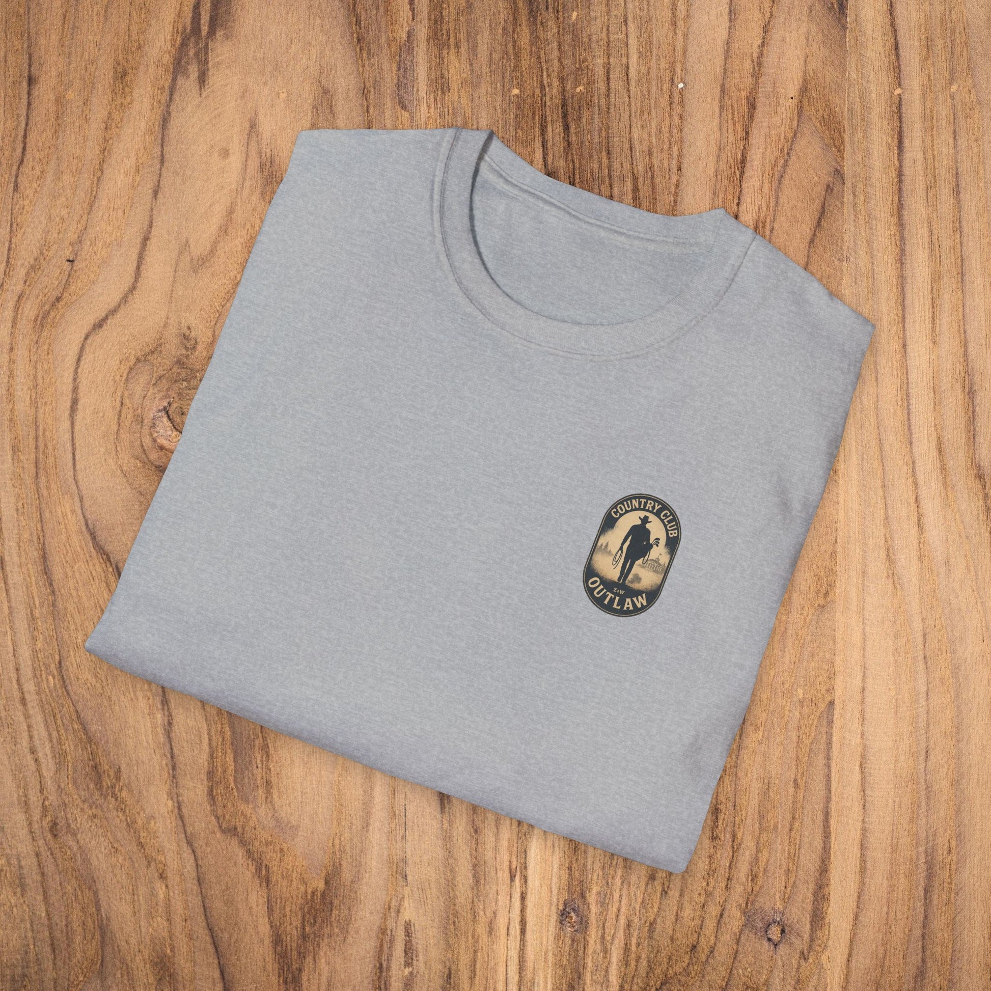 Vintage Southern Gentleman Golf Shirt - Country Club Outlaw Cowboy Tee displayed on a wooden surface, showcasing its classic fit and soft texture.