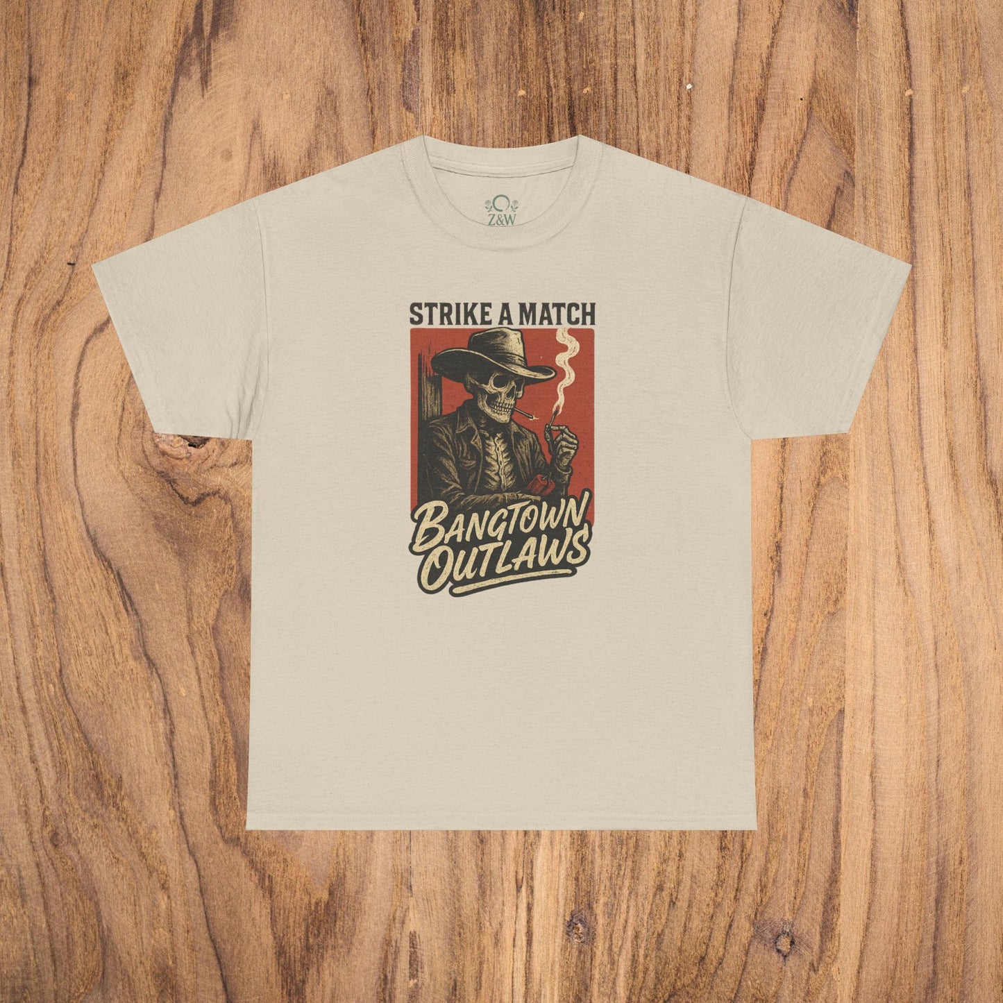 Bangtown Outlaws Retro Casual Party Shirt in beige color showcasing a vintage graphic of a skeleton smoking and the text 'Strike a Match' perfect for gatherings and casual outings.