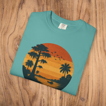 Unisex Garment-Dyed Sunset Tee - Soft 100% Cotton T-Shirt in teal, displaying a colorful sunset scene with palm trees, great for everyday wear.