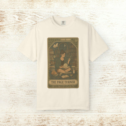 Page Turner Tarot Tee - A comfortable cream soft cotton t-shirt featuring a delightful print of a book enthusiast among shelves, available in sizes S to 4XL.