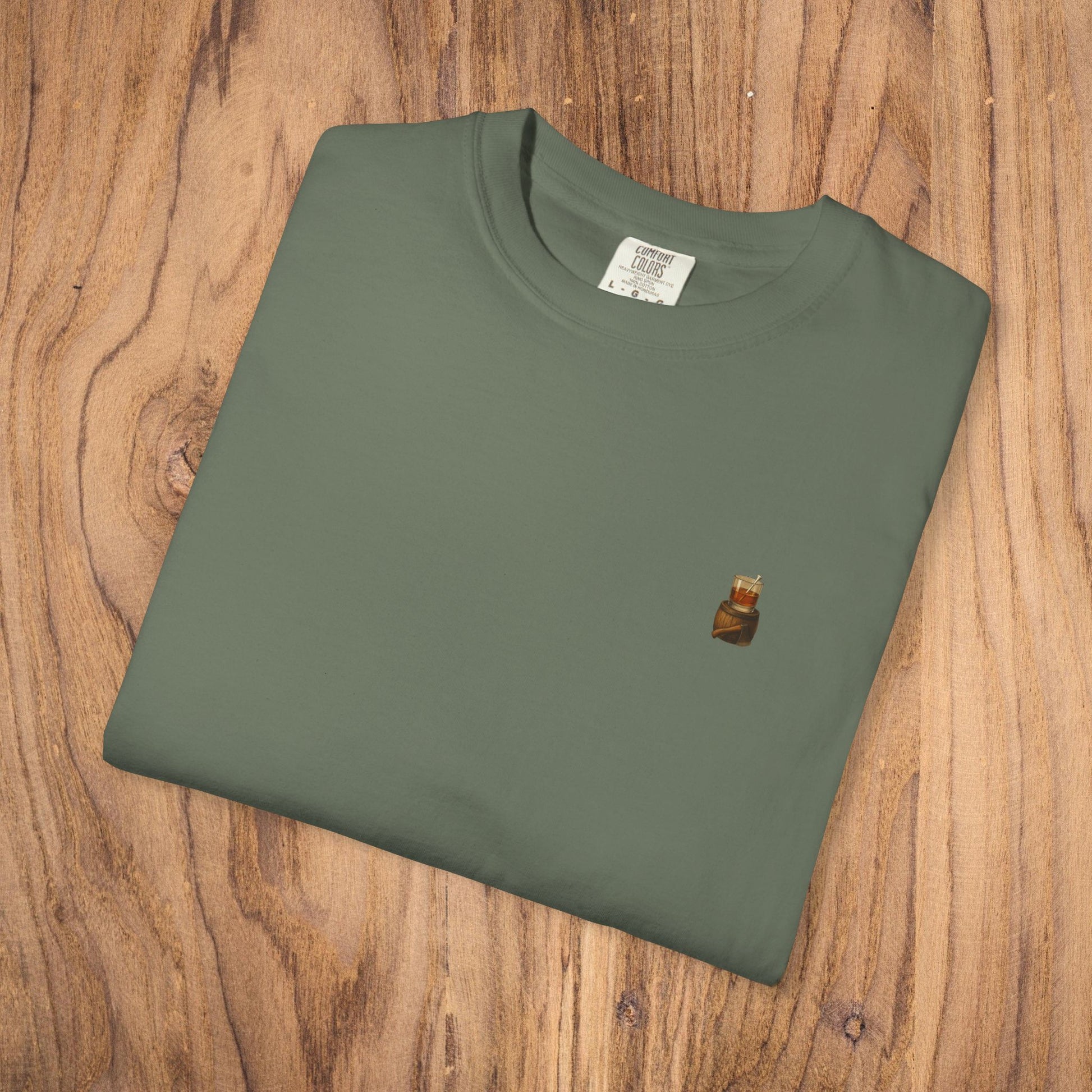 Folded Premium Southern Made T-Shirt in olive green displaying a small logo at the top, ideal for fashionable casual wear.