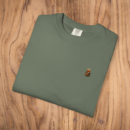 Folded Premium Southern Made T-Shirt in olive green displaying a small logo at the top, ideal for fashionable casual wear.