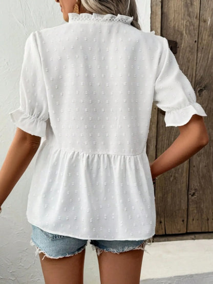 Back view of the Swiss Dot Ruffled V-Neck Blouse with Flounce Sleeves, showcasing its frill design and lightweight fabric, perfect for casual summer outfits.