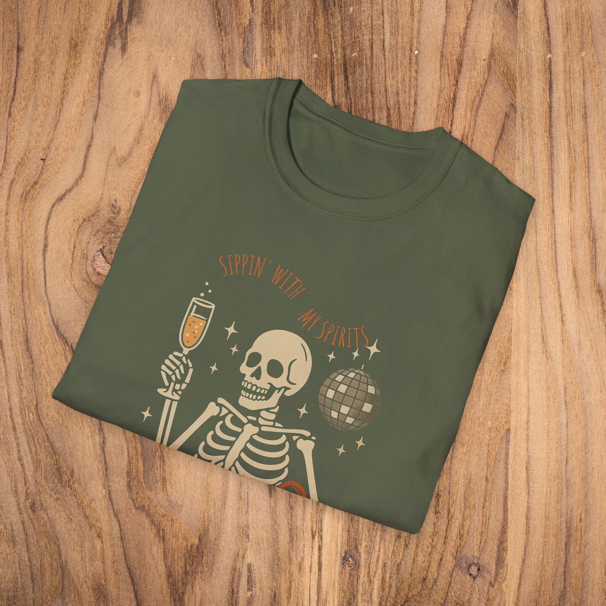 Spooky Spirits Graphic Tee in olive green featuring a skeleton holding a cocktail glass, perfect for Halloween celebrations.