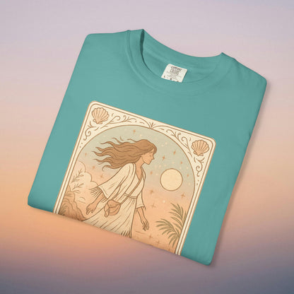 Wanderer Tarot Graphic Tee in teal color, showcasing a unique illustration of a woman exploring nature, crafted from ethically sourced 100% cotton, offered in sizes S to 4XL for ultimate comfort.