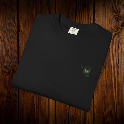 Men's Golf & Whiskey Tee in black showcasing a whiskey glass illustration, crafted from soft, eco-friendly cotton.