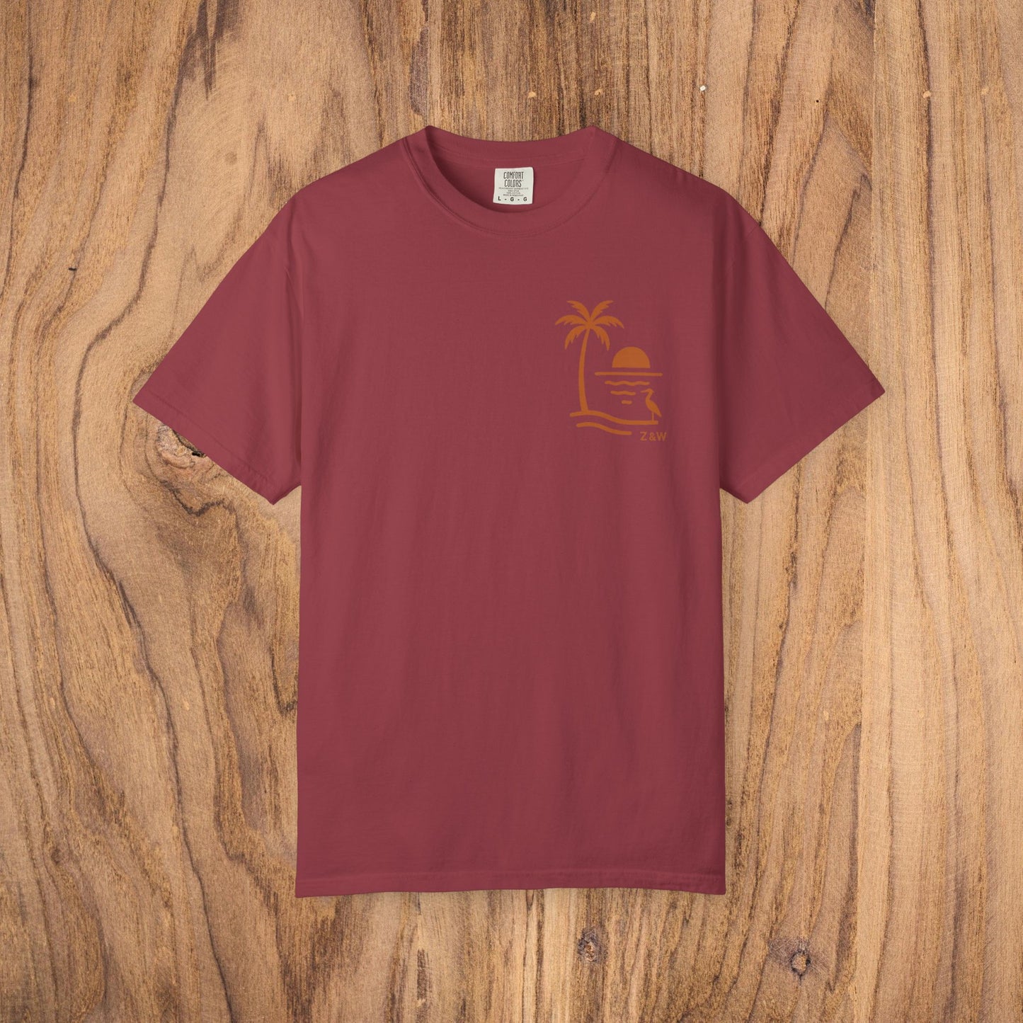Unisex Sunset Palm Tree T-Shirt in deep burgundy - vibrant garment-dyed cotton tee for men and women, stylish for casual or semi-formal gatherings.