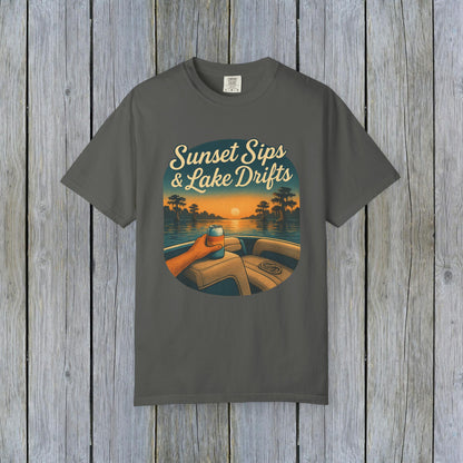 Lake Drifts T-Shirt in charcoal gray featuring a sunset and drink illustration, perfect for a relaxed stylish look.