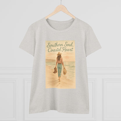 Southern Soul Coated Heart Tee on a hanger, featuring a serene coastal scene with a woman walking on the beach, showcasing a comfortable fit for unisex sizes S-3XL.