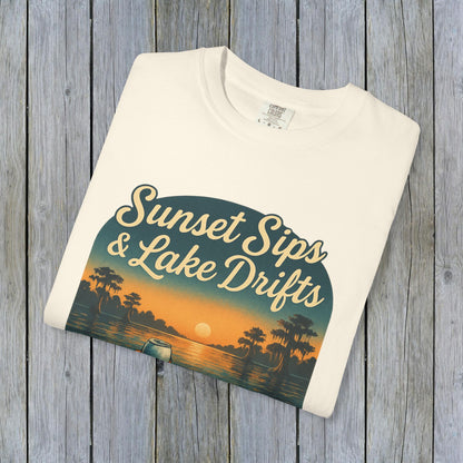 Lake Drifts T-Shirt in cream color, showcasing the sunset sips and lake drifts print, crafted from soft 100% US cotton.