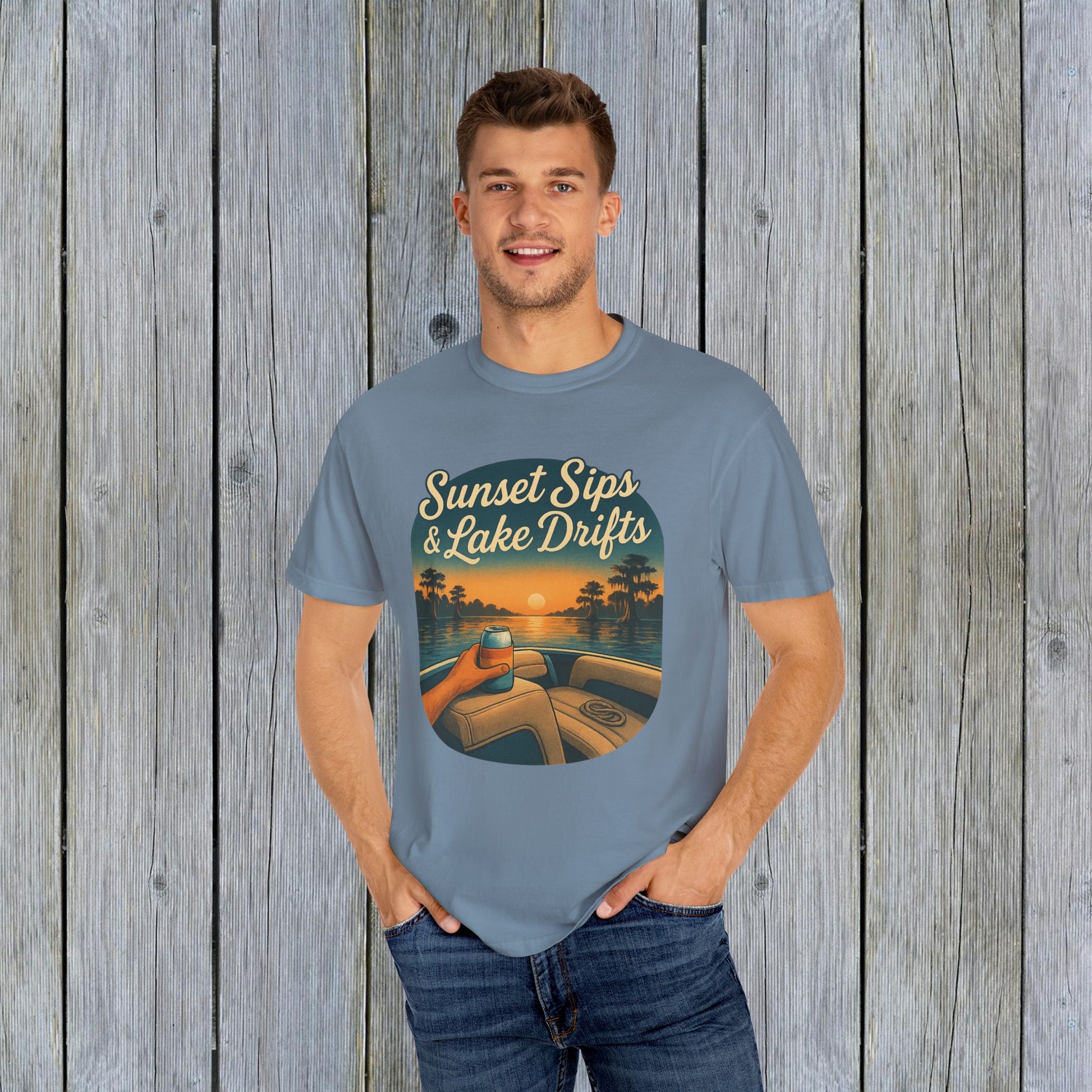Model dressed in soft blue Lake Drifts T-Shirt, featuring sunset sips and lake drifts design, made with ethically sourced US cotton.