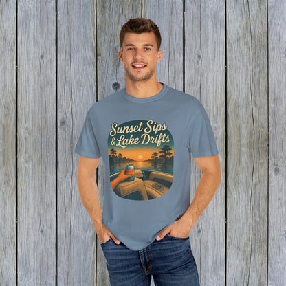 Model dressed in soft blue Lake Drifts T-Shirt, featuring sunset sips and lake drifts design, made with ethically sourced US cotton.