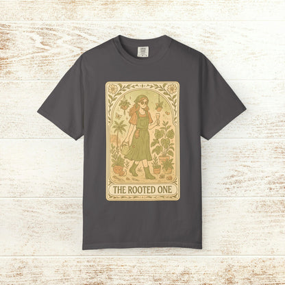 Rooted One Tarot Tee in charcoal gray, displaying an artistic design of a woman surrounded by plants, representing nature and sustainability.