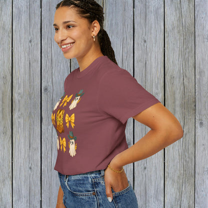 Model showcasing a Cute Halloween T-Shirt with a playful ghost and cowboy boot design. Ideal for stylish unisex fall fashion, crafted from eco-friendly fabric.