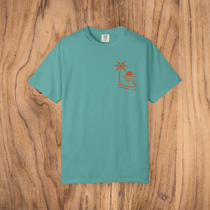 Unisex Sunset Palm Tree T-Shirt in teal, featuring a unique palm tree sunset design, crafted from soft garment-dyed cotton, perfect for both men and women.