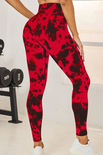 Slightly Stretchy Tie-Dye High Waist Active Leggings in red, showing a side view highlighting the leggings' fit and style.