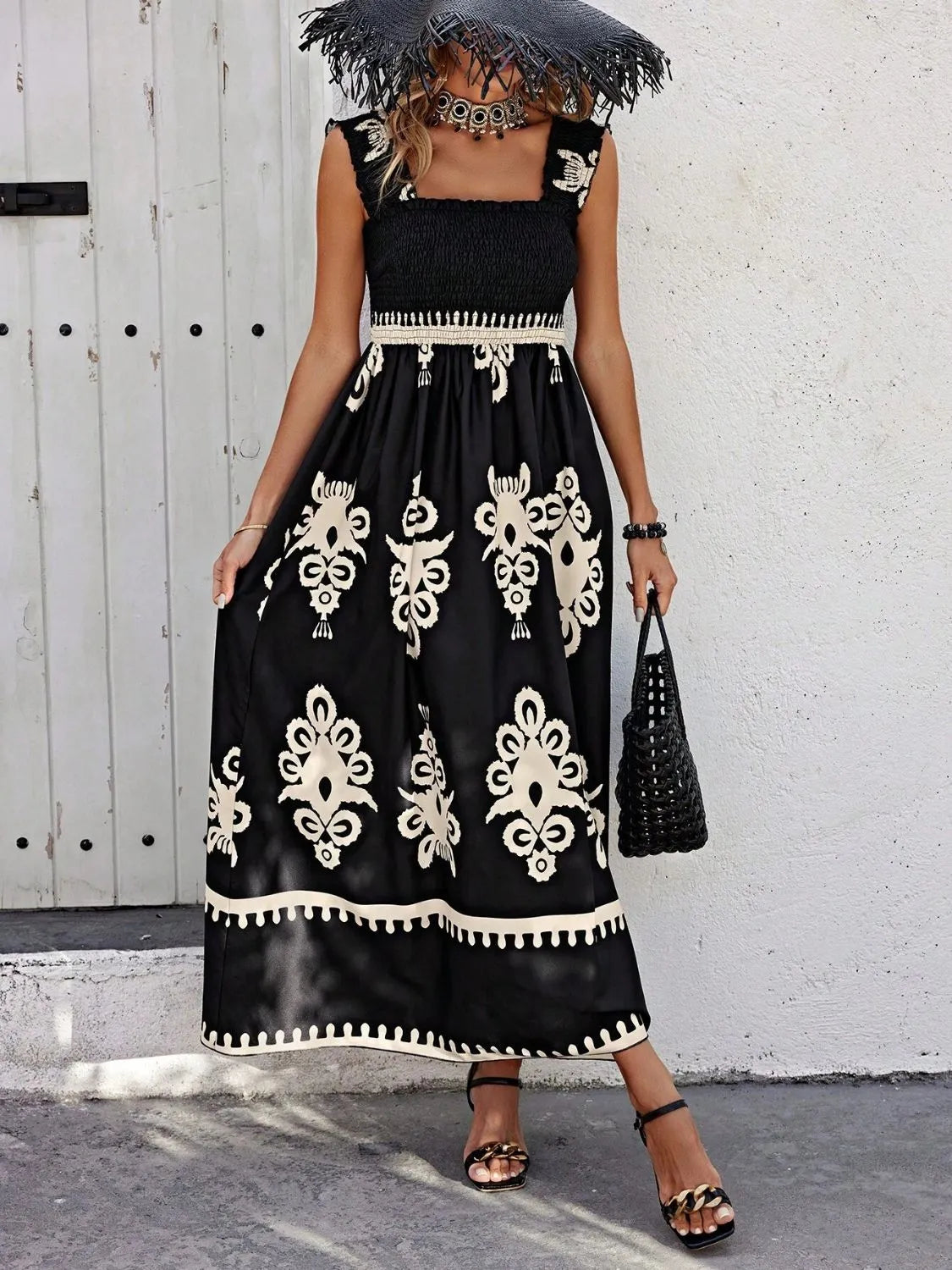 Trendsi Smocked Printed Maxi Dress with Wide Straps showcased on a model in a stylish outdoor setting, featuring a beautiful black and cream print with elegant ruched details.