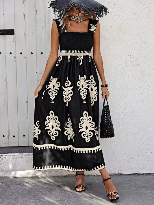 Trendsi Smocked Printed Maxi Dress with Wide Straps showcased on a model in a stylish outdoor setting, featuring a beautiful black and cream print with elegant ruched details.