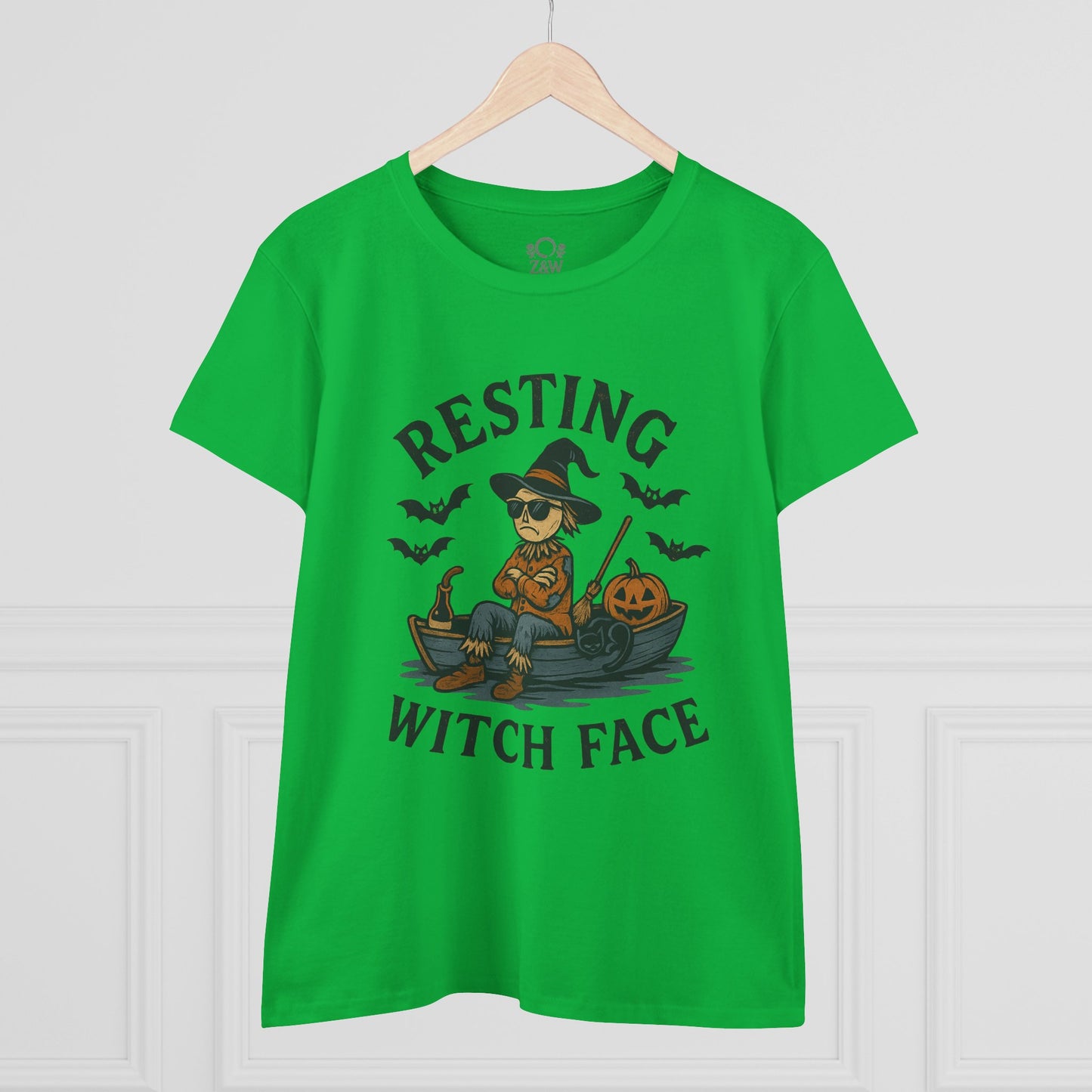 Resting Witch Face Halloween T-Shirt for Women, featuring a fun graphic of a witch on a boat with pumpkins, perfect for parties and gifts. Bright green color highlights the playful design.
