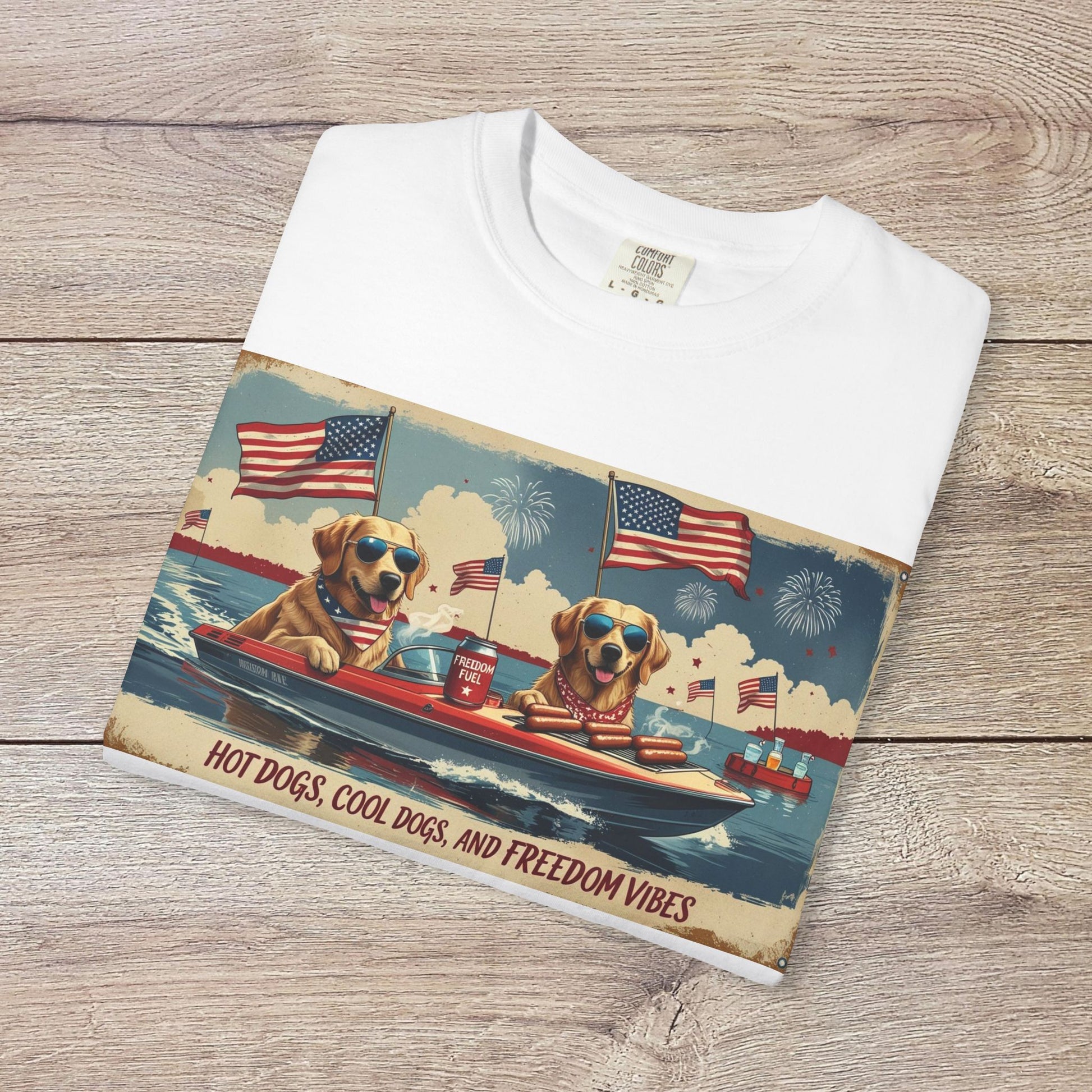 Men's Golden Tee emphasizing a fun graphic of dogs in sunglasses on a boat, representing freedom vibes. Made from soft cotton and designed for comfort.
