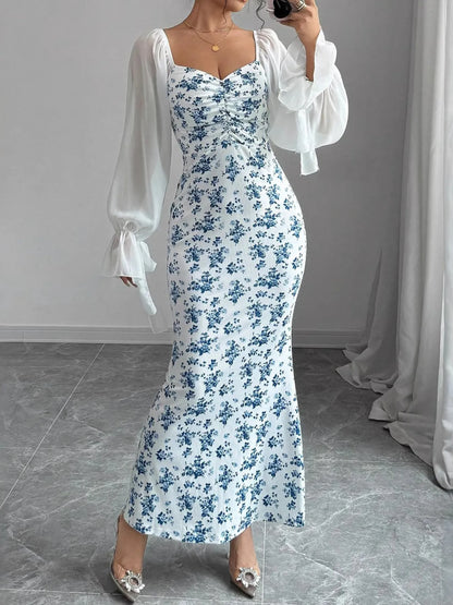 Floral Print Maxi Dress with Sweetheart Neckline and Ruffled Design - Capturing the essence of elegance, this 100% polyester dress showcases a beautiful floral print and ruffled details, ideal for chic summer outings.