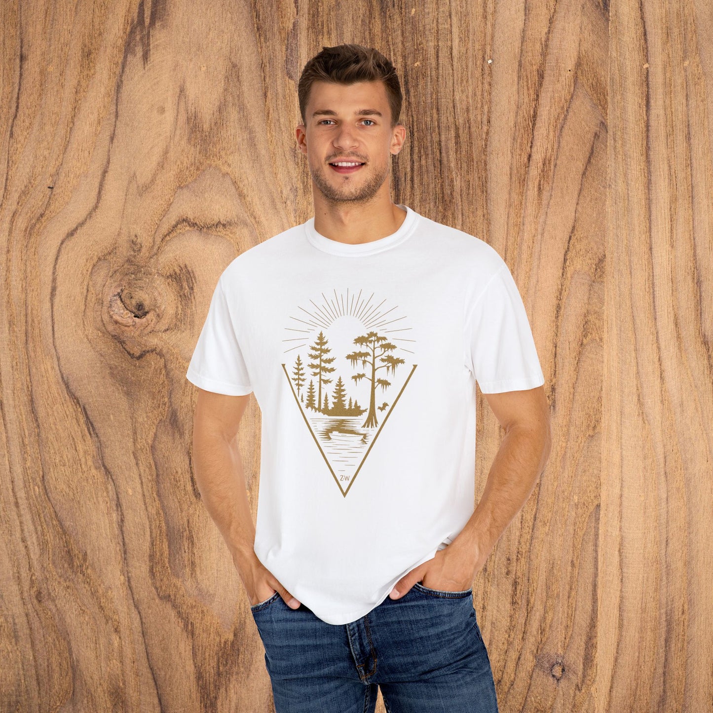 Young man smiling while wearing the Nature Outdoor Vibes Tee in white, featuring a unique forest print, made from 100% US cotton for seamless comfort, sizes S-4XL.