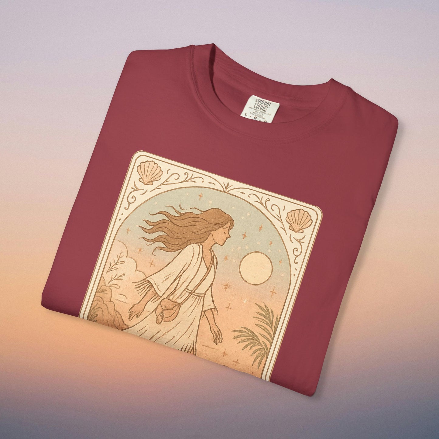 Wanderer Tarot Graphic Tee in burgundy color, made of 100% ethically sourced cotton, highlighting a beautiful design of a woman walking through a scenic landscape, suitable for sizes S to 4XL.
