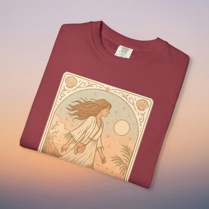 Wanderer Tarot Graphic Tee in burgundy color, made of 100% ethically sourced cotton, highlighting a beautiful design of a woman walking through a scenic landscape, suitable for sizes S to 4XL.