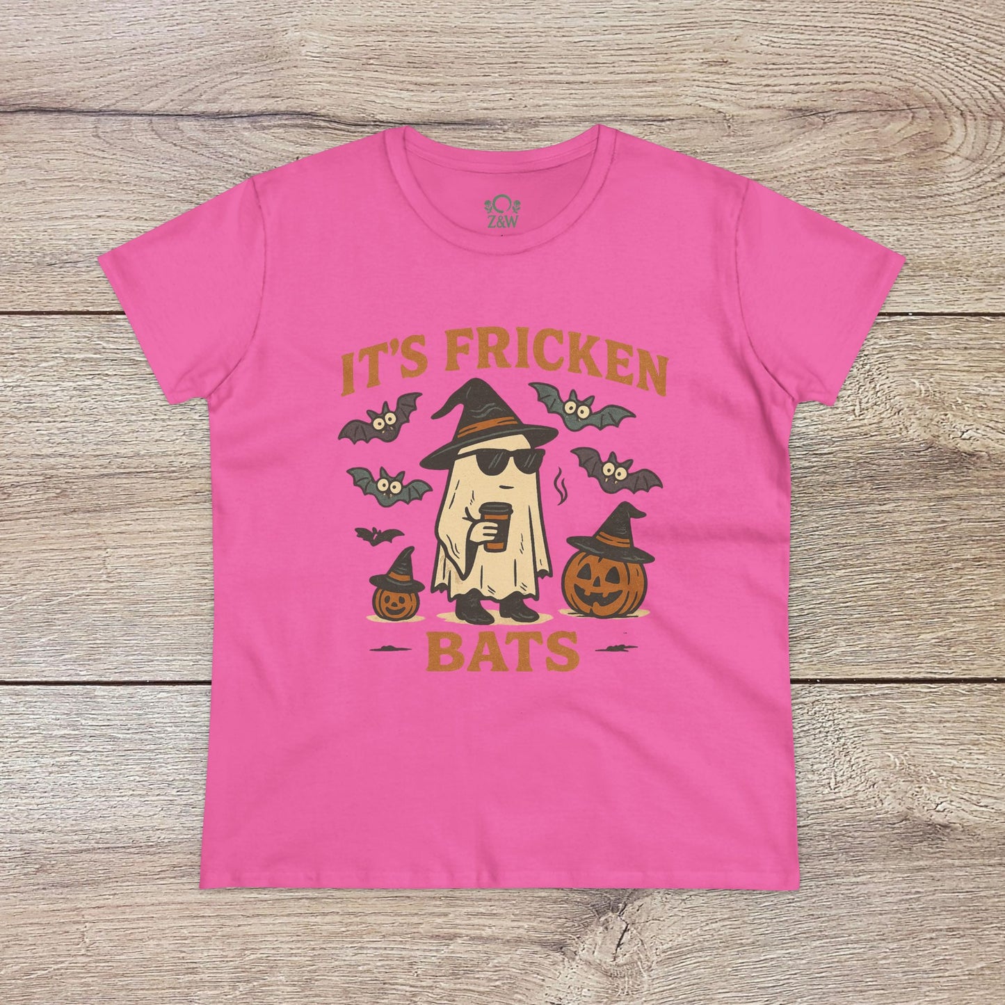 Halloween Unisex T-Shirt in vibrant pink featuring a fun ghost graphic alongside bats and pumpkins. Constructed with 100% cotton, great for trick-or-treating.