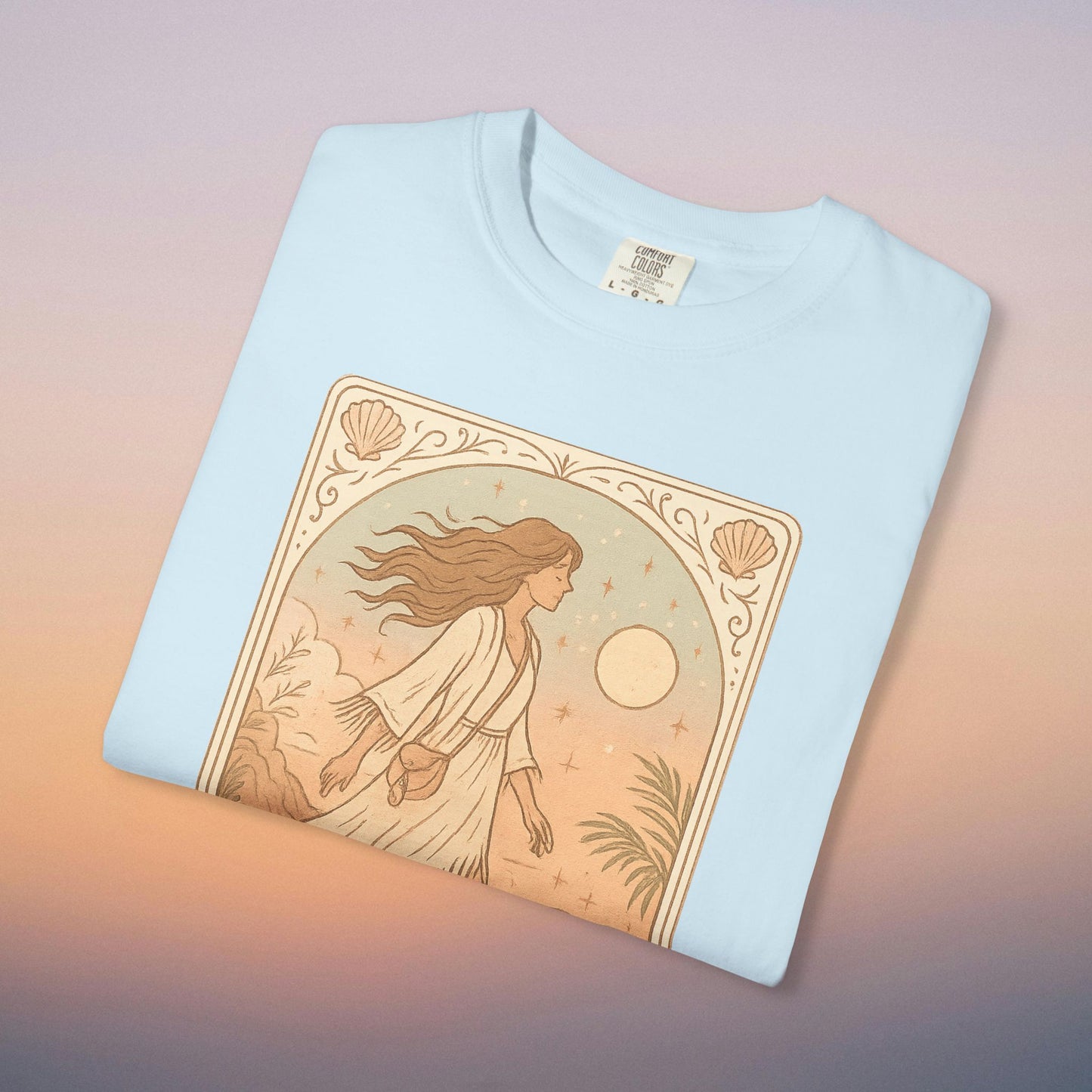 Wanderer Tarot Graphic Tee in soft blue, highlighting an enchanting illustration of a woman amidst nature, ideal for casual wear. Ethically made from high-quality 100% cotton, offers a comfortable fit from sizes S to 4XL.