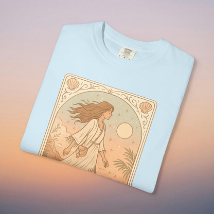 Wanderer Tarot Graphic Tee in soft blue, highlighting an enchanting illustration of a woman amidst nature, ideal for casual wear. Ethically made from high-quality 100% cotton, offers a comfortable fit from sizes S to 4XL.