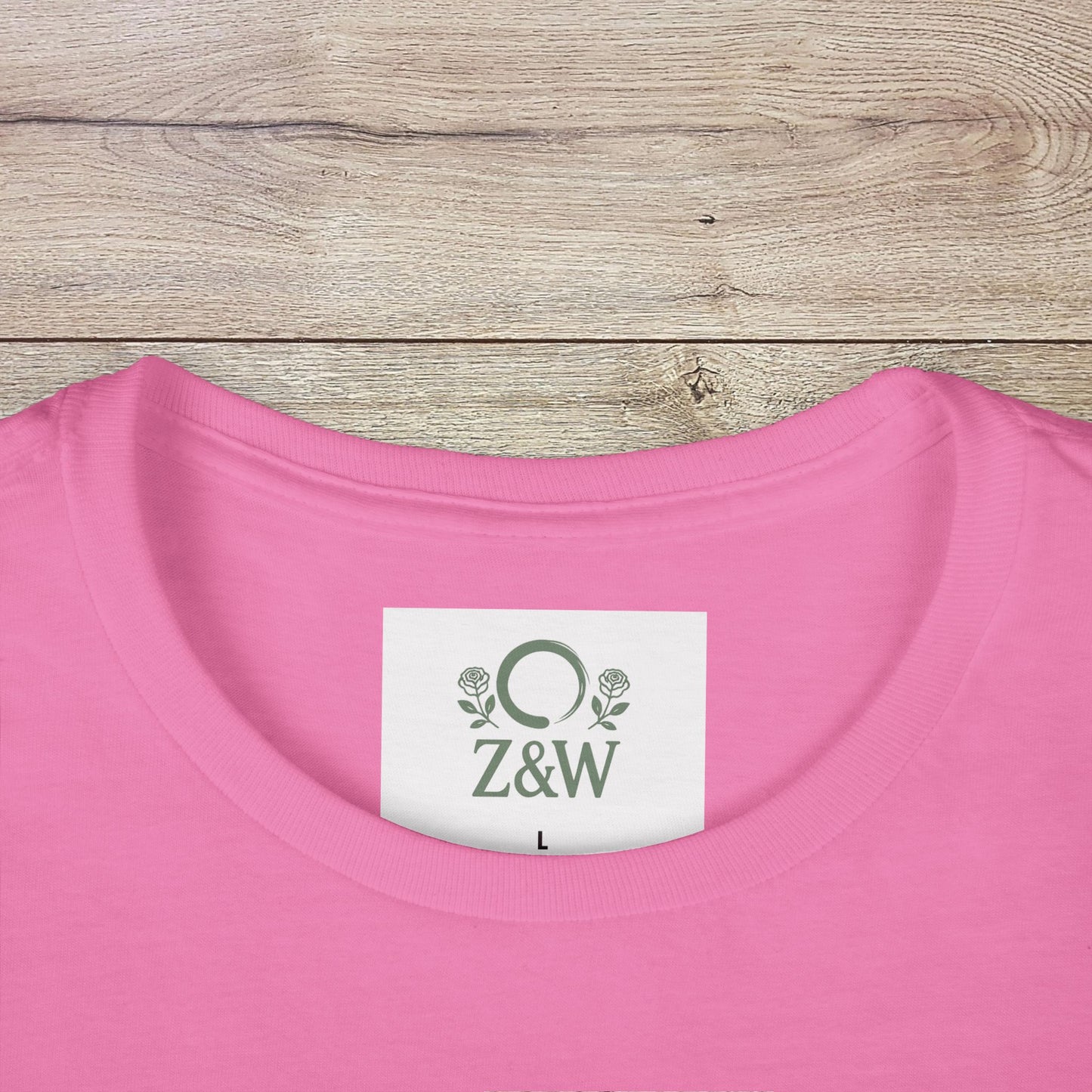 Close-up of the collar label of Sippin' Through The Seasons Slim Fit Tee in pink color, displaying the Z&W brand and size L, crafted from 100% combed cotton for softness.