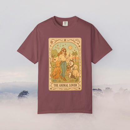 Animal Lover Tarot Tee in rich burgundy, showcasing a charming illustration of a woman with several pets, crafted from 100% cotton for all-day comfort.