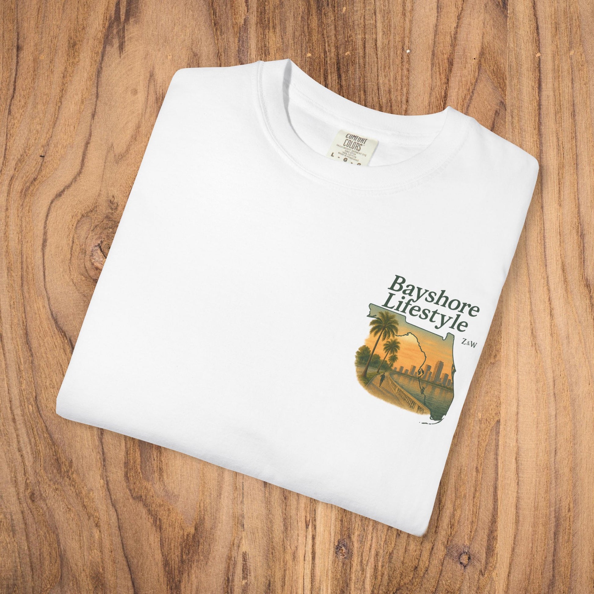 Bayshore Lifestyle Tee - Folded white 100% cotton t-shirt with a graphic design, ideal for everyday comfort and style.