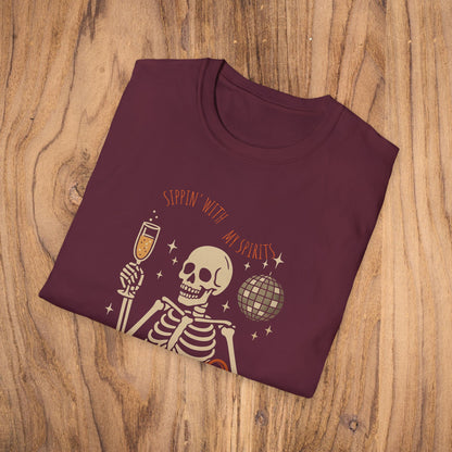 Spooky Spirits Graphic Tee in burgundy showcasing a skeleton with a drink, ideal for a fun Halloween look.