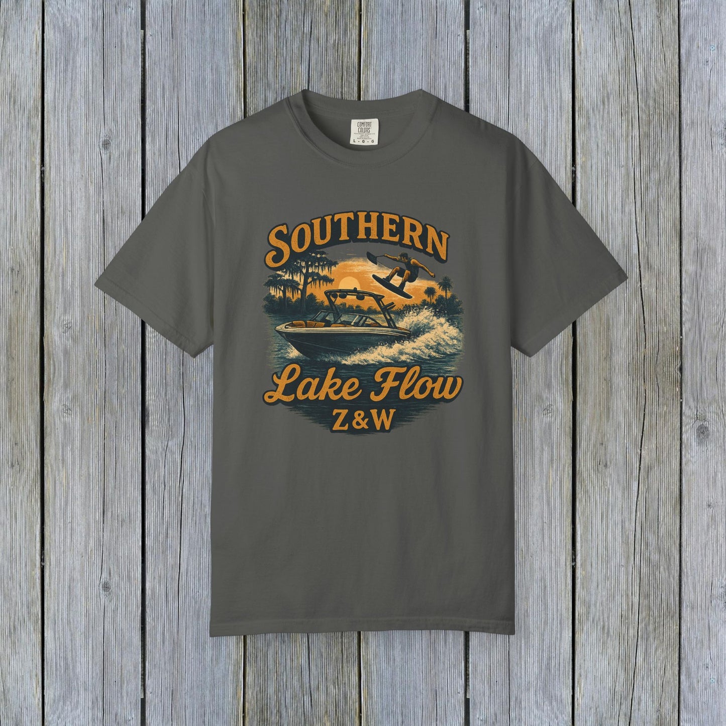 Southern Lake Flow T-Shirt in charcoal gray, highlighting a bold print of a water skier, constructed from 100% US cotton, sustainably made and available in sizes S to 4XL.