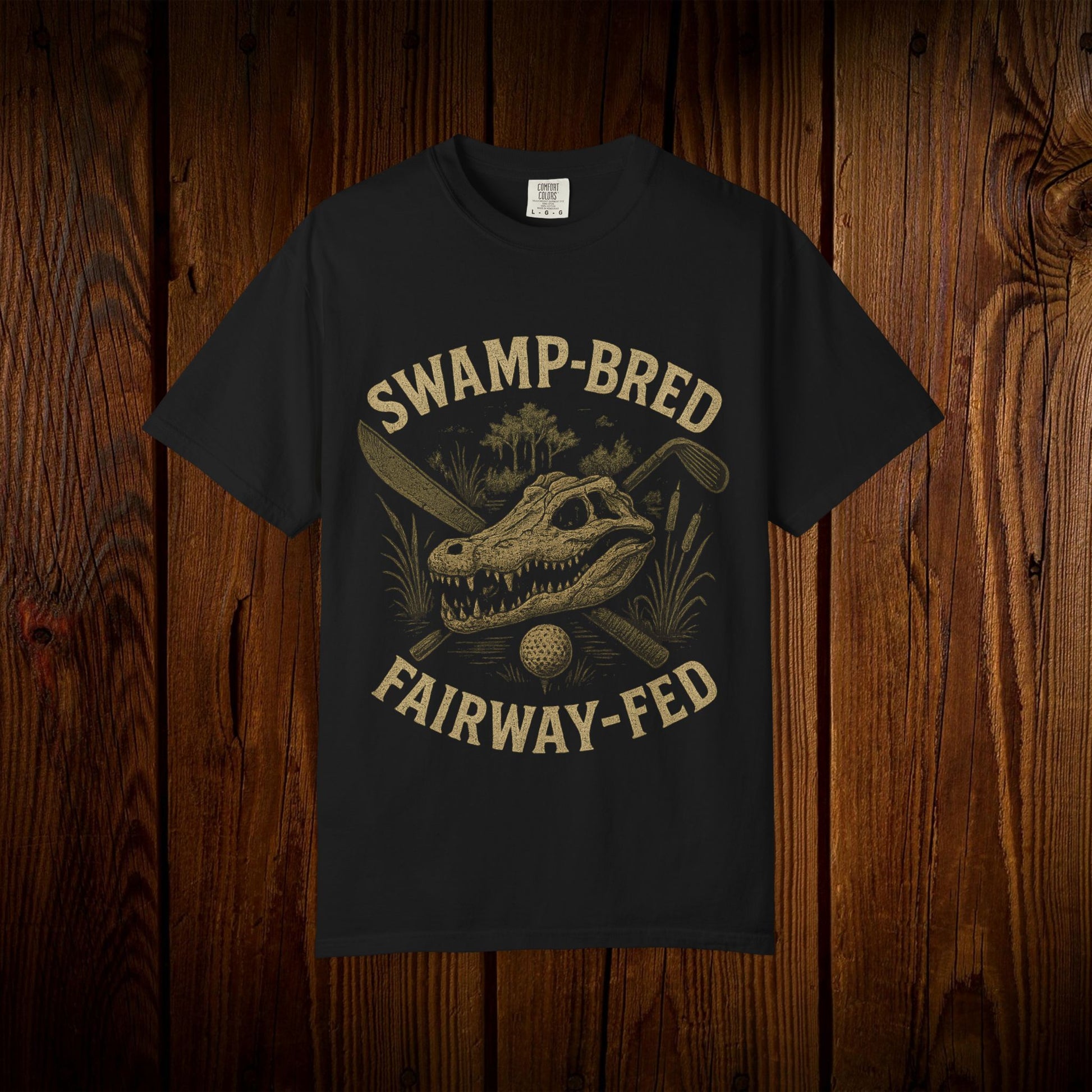 Unisex Swamp-Bred Fairway-Fed Tee featuring a vintage alligator skull and golf clubs graphic, ideal for golf enthusiasts.