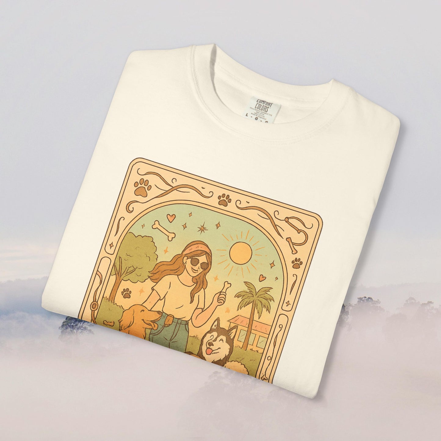 Animal Lover Tarot Tee in creamy off-white, showcasing a playful design of a person with dogs and sun, made of soft and sustainable 100% cotton.