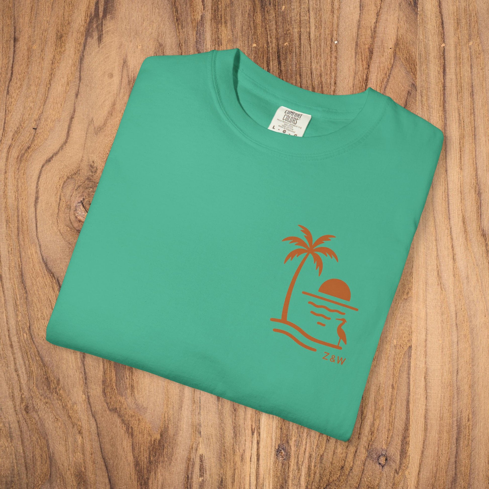 Front view of the Unisex Sunset Palm Tree T-Shirt in a fresh green color, with a unique palm tree and sunset design, great for vibrant summer fashion.